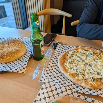 Manakeesh House - Plain Jerusalem Kaaka (left), Cheese and Zatar Manakeesh (right) - Pizza Near Me - Anaheim, California Manakeesh House - Plain Jerusalem Kaaka (left), Cheese and Zatar Manakeesh (right) - Pizza Near Me - Anaheim, California