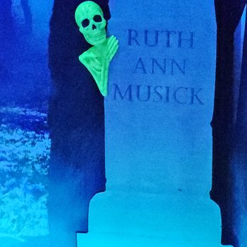 Cryptid Mountain Miniature Golf - Gravestone for an author - Mini Golf Near Me - Morgantown, West Virginia