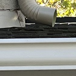 BHT Rain Gutters - downspout emptying onto second floor roof
