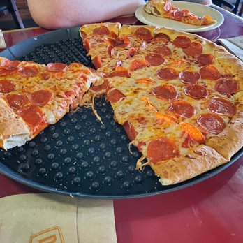 DoubleDave's Pizzaworks - half of a pepperoni pizza - Pizza Near Me - San Angelo, Texas