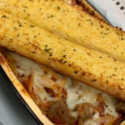 Mancino's Grinders & Pizza - Homemade Garlic bread served with pastas