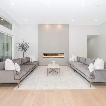 The Supreme Floors - a modern living room with a fireplace - Flooring Near Me - Vancouver, Washington The Supreme Floors - a modern living room with a fireplace - Flooring Near Me - Vancouver, Washington