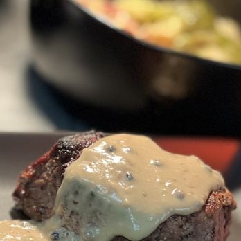 Bolo Steak & Seafood - a steak with gravy sauce on a plate - Seafood Near Me - Orange Beach, Alabama Bolo Steak & Seafood - a steak with gravy sauce on a plate - Seafood Near Me - Orange Beach, Alabama