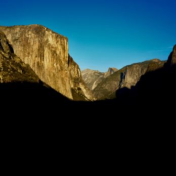 Tunnel View - The sun is setting on Tunnel View and its stunning sight of El Capitan, Half Dome and Bridalveil Fall. - Local Flavor Near Me - Yosemite National Park, California Tunnel View - The sun is setting on Tunnel View and its stunning sight of El Capitan, Half Dome and Bridalveil Fall. - Local Flavor Near Me - Yosemite National Park, California