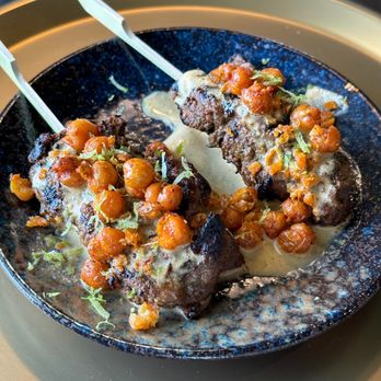 24 Main - a plate of meatballs with sauce and garnish - Bars Near Me - New Albany, Ohio 24 Main - a plate of meatballs with sauce and garnish - Bars Near Me - New Albany, Ohio