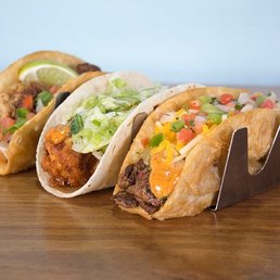 The tacos come with holders to keep them upright.