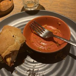 Nando's Restaurant - Half a burger, empty rice bowl, delectable sauce squirted lovingly onto the plate by the friendly staff. Nando's 18-1-22