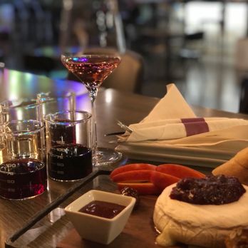 Blacksburg Wine Lab - a cheese board with a variety of cheeses - Wine Bars Near Me - Blacksburg, Virginia