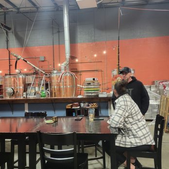 Lazy Boy Brewing - a man and a woman sitting at a table - Breweries Near Me - Everett, Washington Lazy Boy Brewing - a man and a woman sitting at a table - Breweries Near Me - Everett, Washington