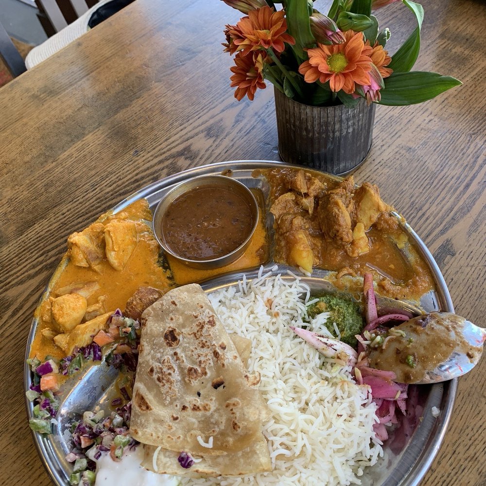 Thali with chicken tikka masala and lamb curry Thali with chicken tikka masala and lamb curry