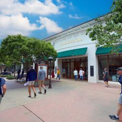 La Cumbre Plaza - Shoppers walk past Williams Sonoma along a tree-lined plaza.