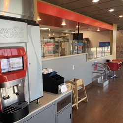 Domino's Pizza - Fancy Coke fountain on top of bottled drinks.