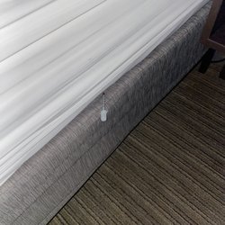 Holiday Inn Express & Suites Decatur - Needle tucked into bed sheets