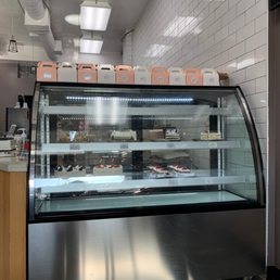 a display case of pastries in a bakery