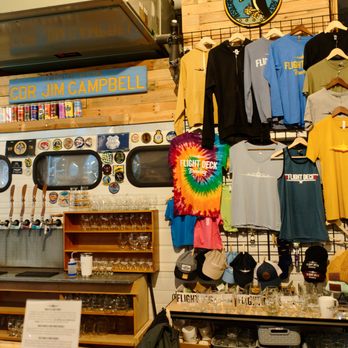 Flight Deck Brewing - a variety of t - shirts on display - Breweries Near Me - Brunswick, Maine