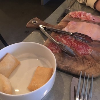 Bar Cotto - Salumi board and (already mostly devoured) fried dough. - Bars Near Me - Seattle, Washington