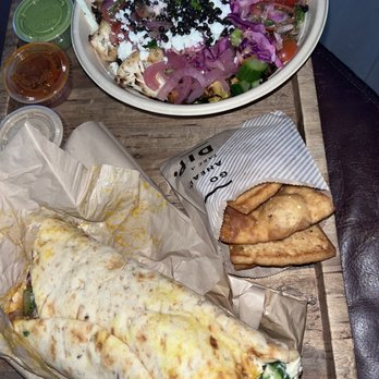 CAVA - Build Your Own Pita with the Braided Lamb, Harissa Avocado Bowl with extra veggies added, pita chips and lots of fun sauces on the side - Salad Near Me - Pensacola, Florida