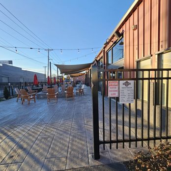 Twisted Track Brewpub - The outside patio in front of the building of the place as one enters the gate. - Brewpubs Near Me - Roanoke, Virginia