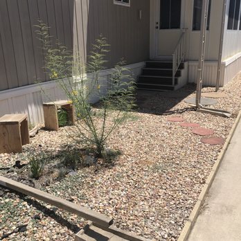Acacia Landscape Construction - Before picture-open to neighbors view and unsteady rocks. - Landscape Architects or Designers Near Me
