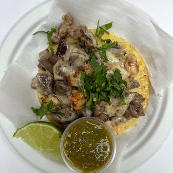 Mariscos El Submarino - Taco El Ray ($5) is NY steak and grilled shrimp, Oaxaca cheese and their special house sauce. - Seafood Near Me - Jackson Heights, New York Mariscos El Submarino - Taco El Ray ($5) is NY steak and grilled shrimp, Oaxaca cheese and their special house sauce. - Seafood Near Me - Jackson Heights, New York