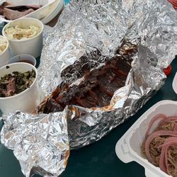 Grove Barbecue Company - Pulled pork with pickles onions, half rack ribs, collard greens, potato salad, coleslaw.