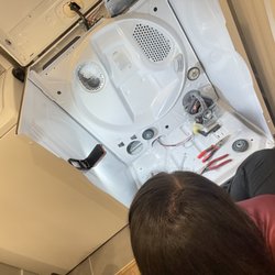 Jacks and Jill Appliance Rx - Connie replacing the drum roller to fix the annoying squealing round the dryer made when it was on.