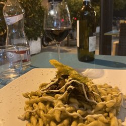 Cavoli Nostri - Pasta with zucchini cream sauce and a crispy zucchini flower on top.