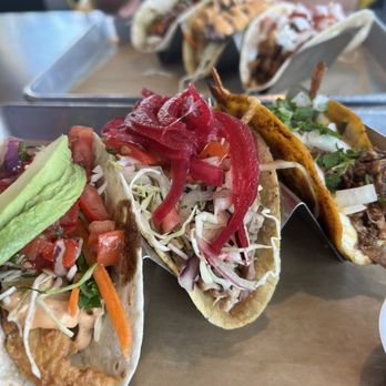 Dos Amigos Tacos - Left to right: Crispy Grouper Taco, Mojo Pork Taco, Birria Taco - Tacos Near Me - Delray Beach, Florida Dos Amigos Tacos - Left to right: Crispy Grouper Taco, Mojo Pork Taco, Birria Taco - Tacos Near Me - Delray Beach, Florida