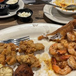 Fried oysters, grilled shrimp, fried catfish, Hush puppies, Mac and cheese, red beans and rice. Fried oysters, grilled shrimp, fried catfish, Hush puppies, Mac and cheese, red beans and rice.