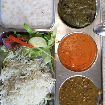 Punjabi Dhaba - Veg thali: sarson da saag, paneer tikka, dal makhani, basmati white rice, salad and raita. Hot naan is served to your table along with this! - Food Trucks Near Me - Mississauga, Ontario Punjabi Dhaba - Veg thali: sarson da saag, paneer tikka, dal makhani, basmati white rice, salad and raita. Hot naan is served to your table along with this! - Food Trucks Near Me - Mississauga, Ontario