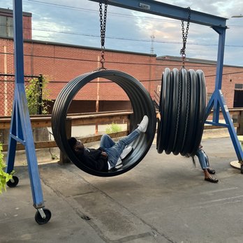 Camp North End - Outdoor Swings in Alleyway of Camp North - Specialty Food Near Me - Charlotte, North Carolina Camp North End - Outdoor Swings in Alleyway of Camp North - Specialty Food Near Me - Charlotte, North Carolina