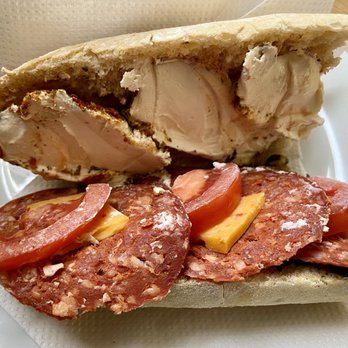 Tonton Garby - Baguette Fiona: black olive tapenade, chevre italie mio amore, chili gouda, chorizo, and tomatoes - Fast Food Near Me - Brussels, BRU Tonton Garby - Baguette Fiona: black olive tapenade, chevre italie mio amore, chili gouda, chorizo, and tomatoes - Fast Food Near Me - Brussels, BRU