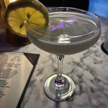Retail Therapy - The flower power shot, but as a cocktail. Reaaally loved this drink, had good floral flavor (elderflower and violet) - which I LOVE - Cocktail Bars Near Me - Austin, Texas