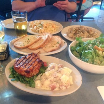 Paulie's - Pork chop, mushroom pasta, shrimp scampi, caesar salad, glass of beer, and glass of white wine. - Sandwiches Near Me - Houston, Texas
