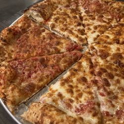 Apollo Pizza - 2nd pizza, paid $4 xtra to get normal amount of cheese. 1st pizza was awful. Almost no cheese. Overdone. Hard/crunchy. Terrible.