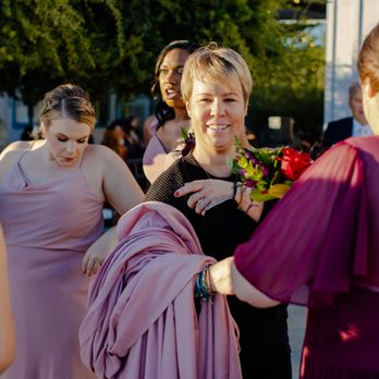 Breezy Day - Holding wraps during pictures. She also brought me (the bride) wine and appetizers. Photos by Katherine Beth Photography. - Wedding Planning Near Me