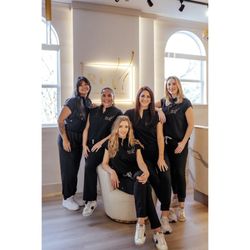 Professional team of licensed aesthetic injectors and skincare specialists at a luxury Miramar Beach, FL med spa.