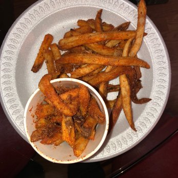 Five Guys - a plate of french fries and a bowl of ketchup - Burgers Near Me - Yonkers, New York