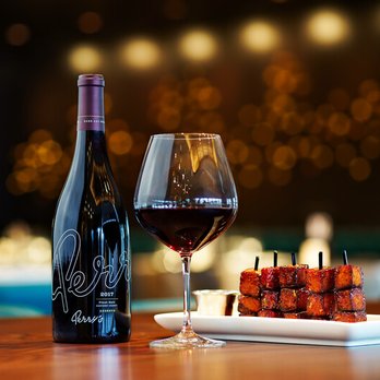 Perry's Steakhouse & Grille - Memorial City - Perry's Pinot Noir paired with Perry's Mini Pork Chop Bites - Steakhouses Near Me - Houston, Texas Perry's Steakhouse & Grille - Memorial City - Perry's Pinot Noir paired with Perry's Mini Pork Chop Bites - Steakhouses Near Me - Houston, Texas