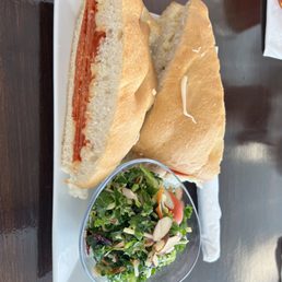 Sena Spicy sandwich and kale side salad Sena Spicy sandwich and kale side salad