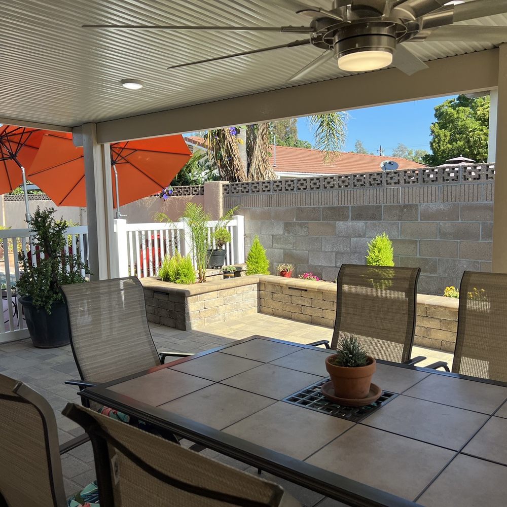 Unique Home Builders - Another view of the new 30' long 17" high planter using rustic sand mocha and bullnose. Also, the Alumina wood patio and vinyl fence. - Masonry/Concrete Near Me - Encino, California