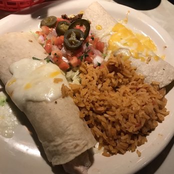 Chuy's - Chicken and steak enchilada with the sauce on the side - Tex-Mex Near Me - Humble, Texas Chuy's - Chicken and steak enchilada with the sauce on the side - Tex-Mex Near Me - Humble, Texas