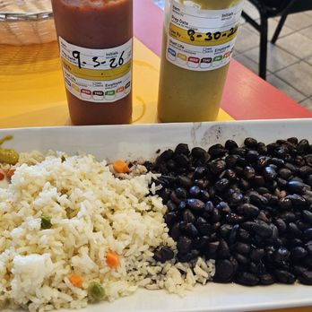 Killa Mama - I ate beans & rice for lunch. Appreciate date on green sauce. It's definitely medium hot. - Peruvian Near Me - Los Angeles, California