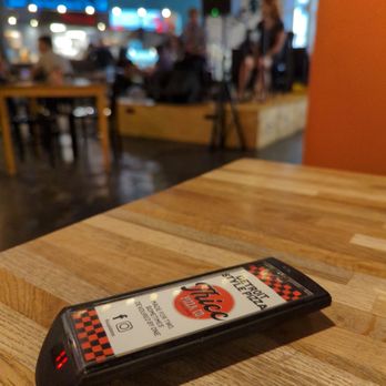 Thicc Pizza Co. - a remote control on a table - Pizza Near Me - Albuquerque, New Mexico