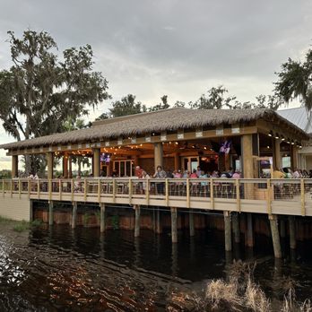 The Natives Restaurants - Deck toward tiki hut area - American Near Me - The Villages, Florida The Natives Restaurants - Deck toward tiki hut area - American Near Me - The Villages, Florida