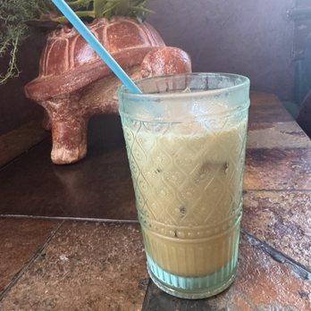 Hummingbird Apothecary - Iced latte with oat milk and coconut flavoring. How cute is that turtle!!! - Coffee & Tea Near Me - Knoxville, Tennessee