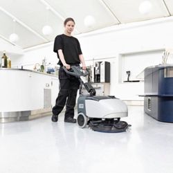 Kaweah Maintenance - Using a micro scrubber to apply a neutral floor cleaner, scrub and vacuum in one pass.
