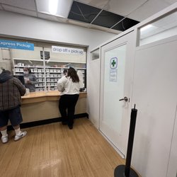 Walgreens - Pharmacy line, missing ceiling panels and water stains