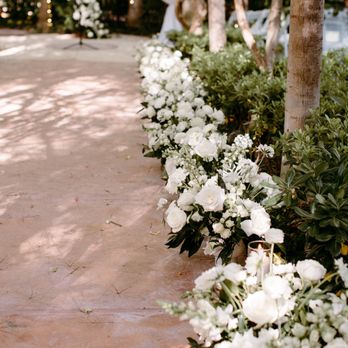 Desert Rose Florals - Centerpieces lining the aisle (later moved to the reception). - Florists Near Me Desert Rose Florals - Centerpieces lining the aisle (later moved to the reception). - Florists Near Me