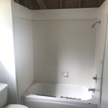 Shugarman's Bath - soffit removed in ceiling with the old bathtub/fixtures that used a curtain - General Contractors Near Me - San Diego, California Shugarman's Bath - soffit removed in ceiling with the old bathtub/fixtures that used a curtain - General Contractors Near Me - San Diego, California